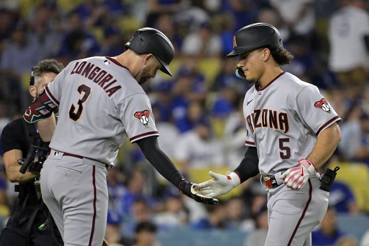 Oct 7, 2023; Los Angeles, California, USA; Arizona Diamondbacks center fielder Alek Thomas (5) reacts after hitting a home run against the Los Angeles Dodgers during the seventh inning for game one of the NLDS for the 2023 MLB playoffs at Dodger Stadium.