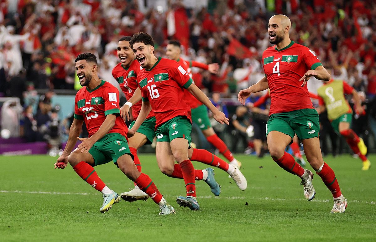Morocco celebrates after win over Spain.