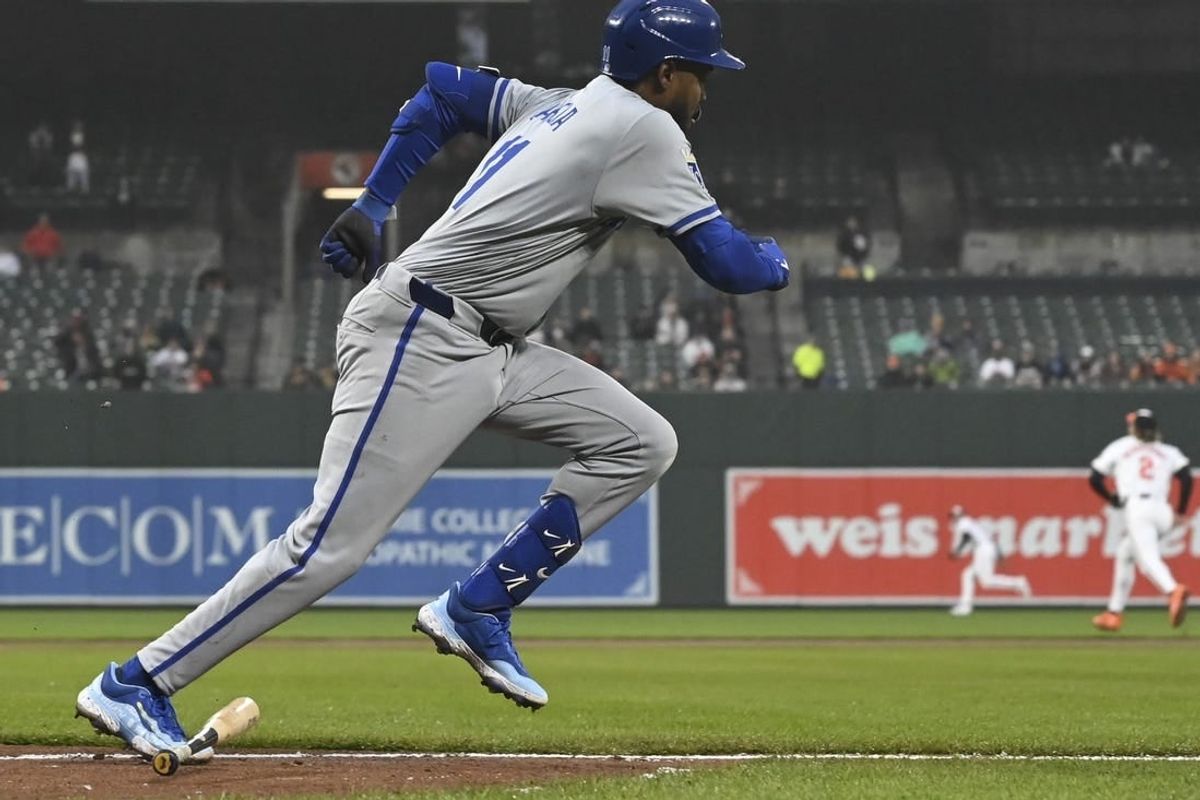 Apr 2, 2024; Baltimore, Maryland, USA; Kansas City Royals third baseman Maikel Garcia (11) runs out a second inning rbi double against the Baltimore Orioles  at Oriole Park at Camden Yards.