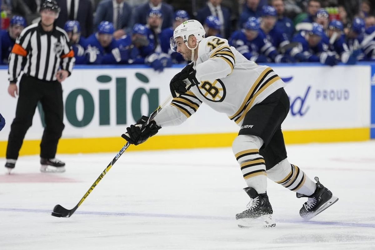Mar 4, 2024; Toronto, Ontario, CAN; Boston Bruins defenseman Kevin Shattenkirk (12) shoots the puck against the Toronto Maple Leafs during the second period at Scotiabank Arena.