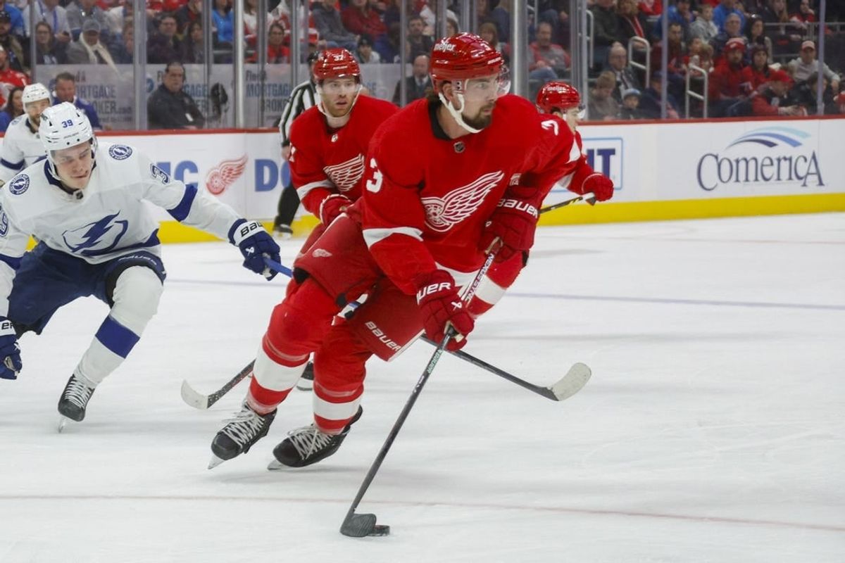 Jan 21, 2024; Detroit, Michigan, USA; Detroit Red Wings defenseman Justin Holl (3) handles the puck during the first period at Little Caesars Arena.