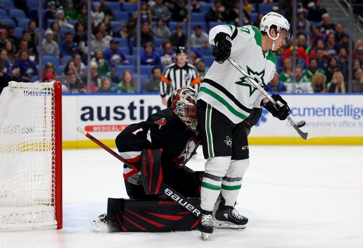 Feb 6, 2024; Buffalo, New York, USA;  Dallas Stars left wing Mason Marchment (27) deflects a shot on Buffalo Sabres goaltender Ukko-Pekka Luukkonen (1) during the third period at KeyBank Center.