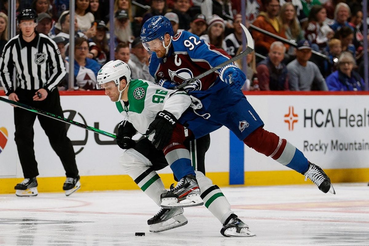 Apr 23, 2025; Denver, Colorado, USA; Colorado Avalanche left wing Gabriel Landeskog (92) checks Dallas Stars right wing Mikko Rantanen (96) in the first period in game three of the first round of the 2025 Stanley Cup Playoffs at Ball Arena. Mandatory Credit: Isaiah J. Downing-Imagn Images