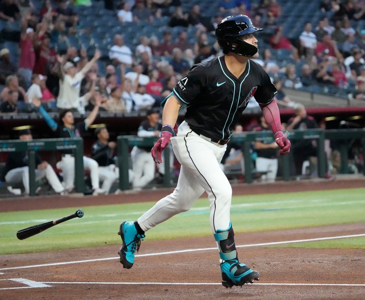Arizona Diamondbacks’ Corbin Carroll (7) drops his bat after connecting for a solo home run against the Tampa Bay Rays during the first inning at Chase Field Apr 23, 2025, in Phoenix.