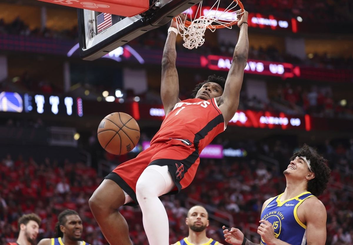Apr 23, 2025; Houston, Texas, USA; Houston Rockets forward Amen Thompson (1) dunks the ball as Golden State Warriors forward Gui Santos (15) defends during the fourth quarter during game two of the first round for the 2024 NBA Playoffs at Toyota Center. Mandatory Credit: Troy Taormina-Imagn Images