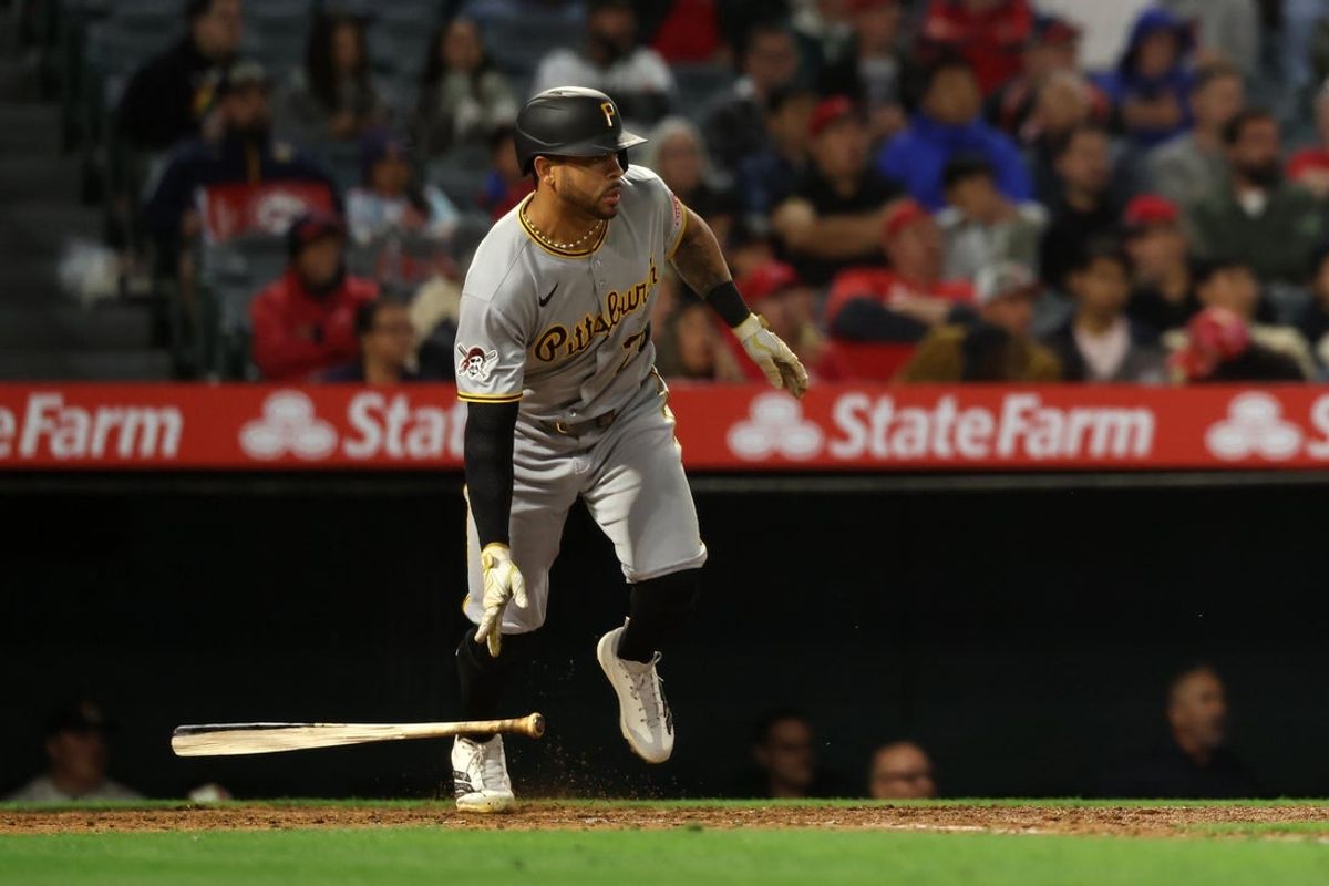 Apr 23, 2025; Anaheim, California, USA;  Pittsburgh Pirates left fielder Tommy Pham (28) hits an RBI single during the ninth inning against the Los Angeles Angels at Angel Stadium. Mandatory Credit: Kiyoshi Mio-Imagn Images