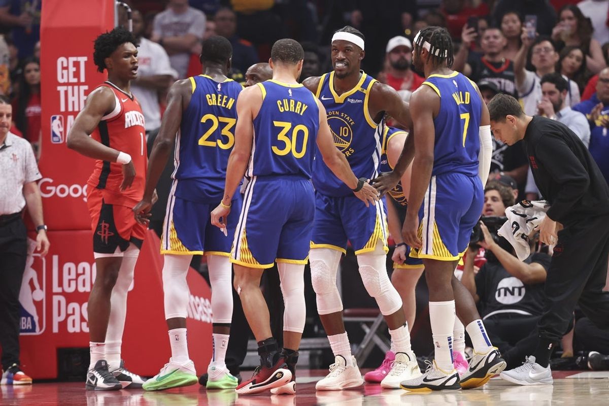 Apr 23, 2025; Houston, Texas, USA; Golden State Warriors forward Jimmy Butler III (10) reacts after suffering what has been diagnosed as a "deep glute muscle contusion" during the first quarter during game two of the first round for the 2024 NBA Playoffs against the Houston Rockets at Toyota Center. Mandatory Credit: Troy Taormina-Imagn Images