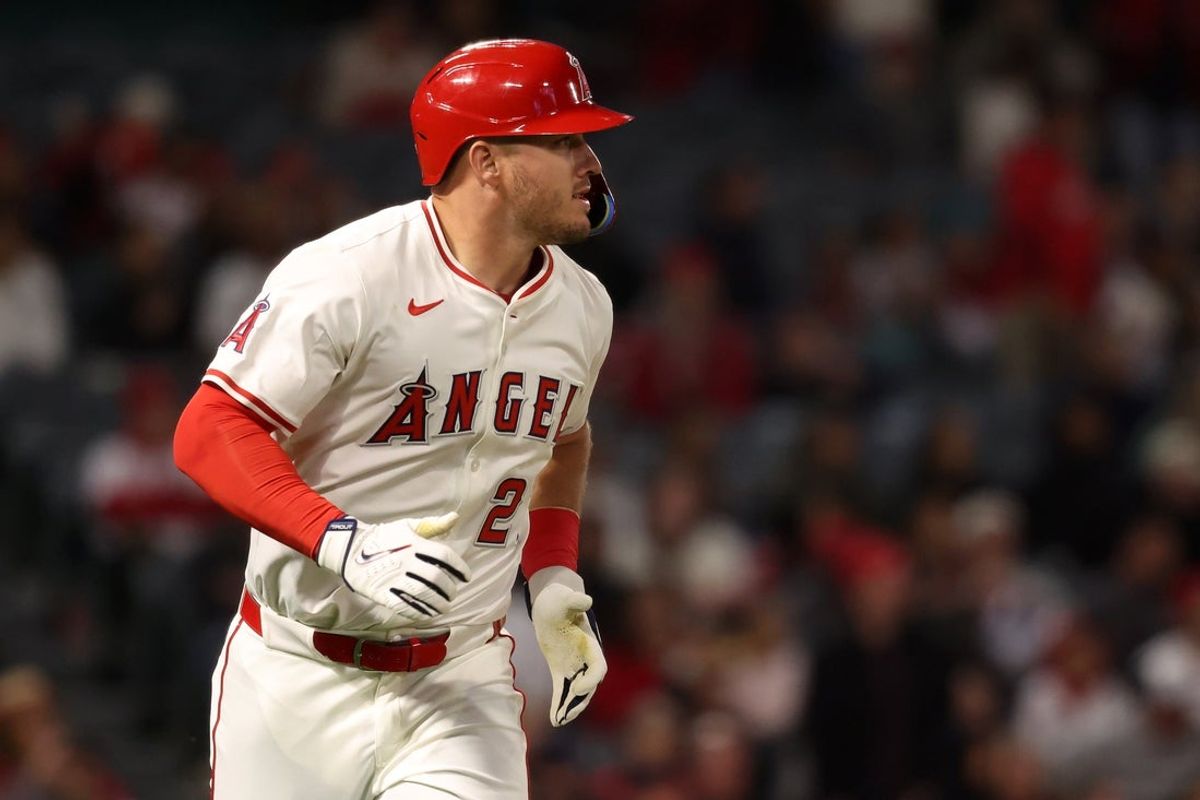 Apr 23, 2025; Anaheim, California, USA;  Los Angeles Angels right fielder Mike Trout (27) flies out to end the game in the ninth inning against the Pittsburgh Pirates at Angel Stadium. Mandatory Credit: Kiyoshi Mio-Imagn Images