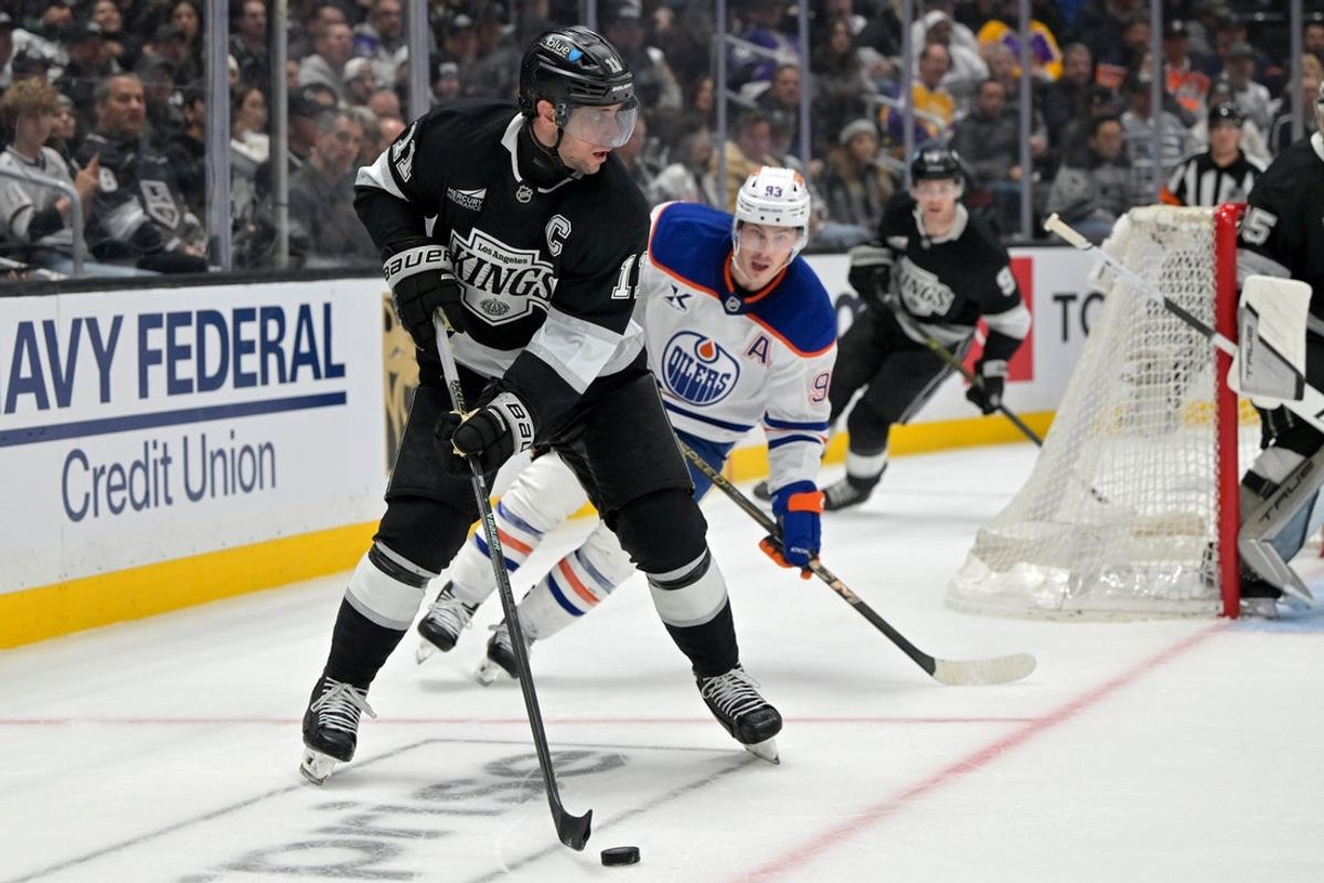 Apr 23, 2025; Los Angeles, California, USA; Los Angeles Kings center Anze Kopitar (11) handles the puck in the third period of game 2 of the 2025 Stanley Cup Playoffs against the Edmonton Oilers at Crypto.com Arena. Mandatory Credit: Jayne Kamin-Oncea-Imagn Images