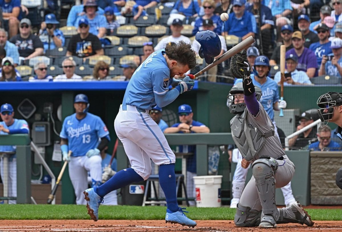 Apr 24, 2025; Kansas City, Missouri, USA;  Kansas City Royals shortstop Bobby Witt Jr. (7) reacts after getting hit by a pitch from Colorado Rockies starting pitcher German Marquez (not pictured) in the first inning at Kauffman Stadium. Mandatory Credit: Peter Aiken-Imagn Images