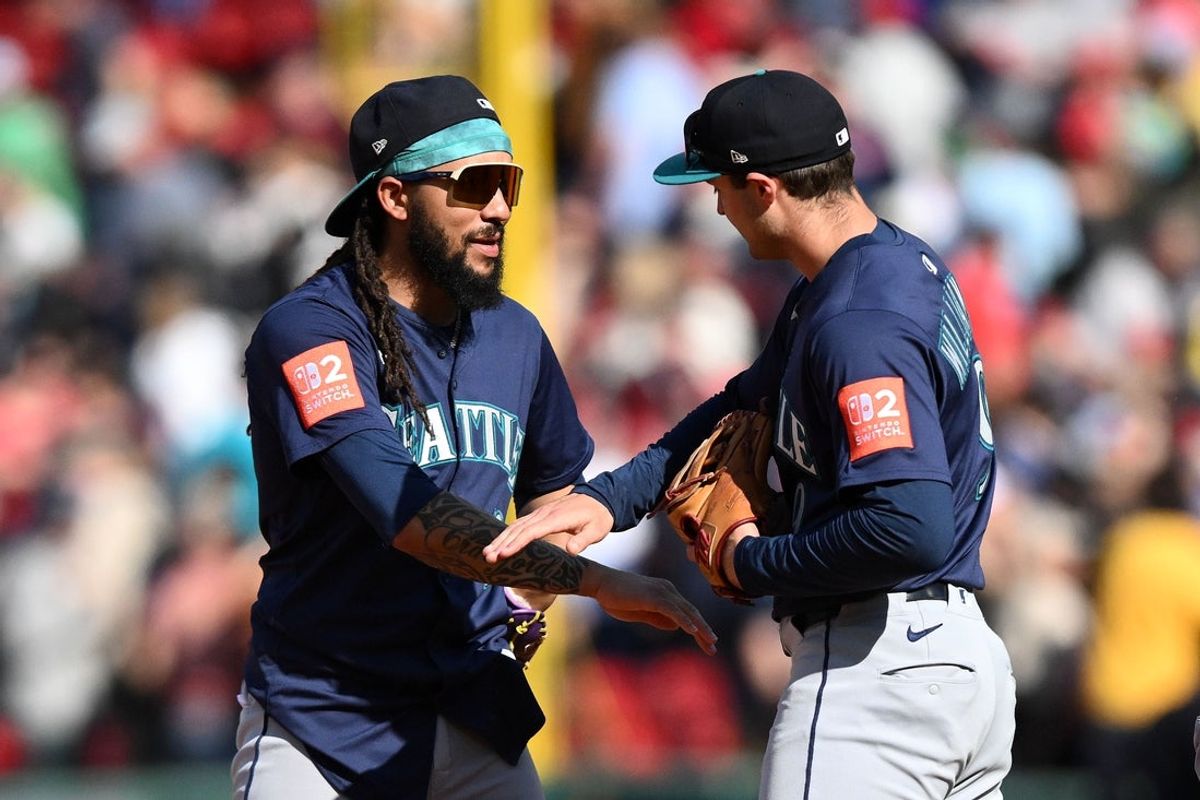 Apr 24, 2025; Boston, Massachusetts, USA; Seattle Mariners shortstop J.P. Crawford (3) and third base Ben Williamson (9) high-five after a game against the Boston Red Sox at Fenway Park. Mandatory Credit: Brian Fluharty-Imagn Images