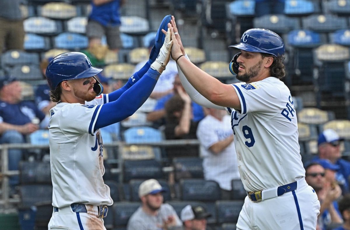 Apr 24, 2025; Kansas City, Missouri, USA; Kansas City Royals Vinnie Pasquantino (9) and Bobby Witt Jr. (7) celebrate after scoring runs in the fifth inning against the Colorado Rockies at Kauffman Stadium. Mandatory Credit: Peter Aiken-Imagn Images