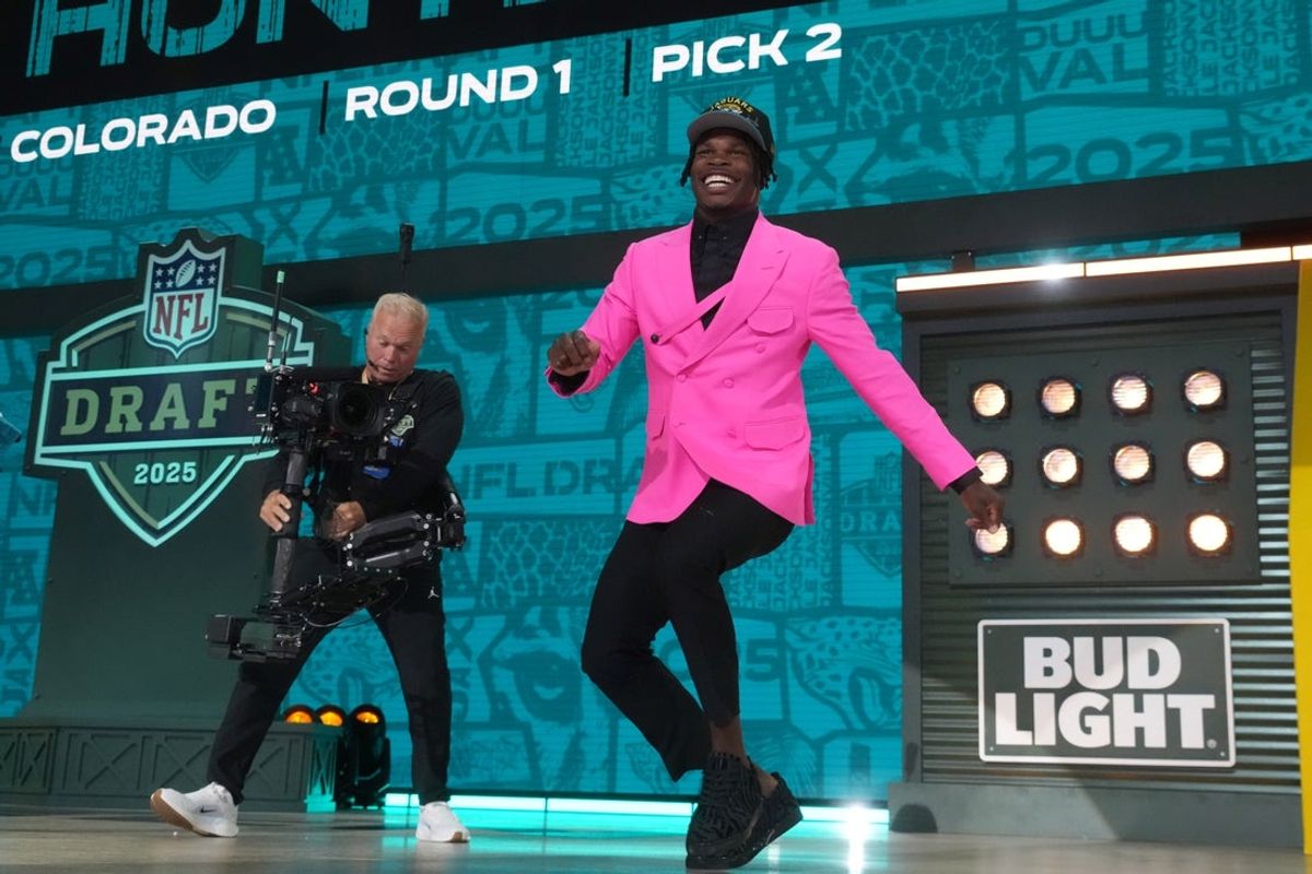 Apr 24, 2025; Green Bay, WI, USA; Colorado Buffaloes wide receiver Travis Hunter is selected by the Jacksonville Jaguars as the number two pick in the first round of the 2025 NFL Draft at Lambeau Field. Mandatory Credit: Kirby Lee-Imagn Images