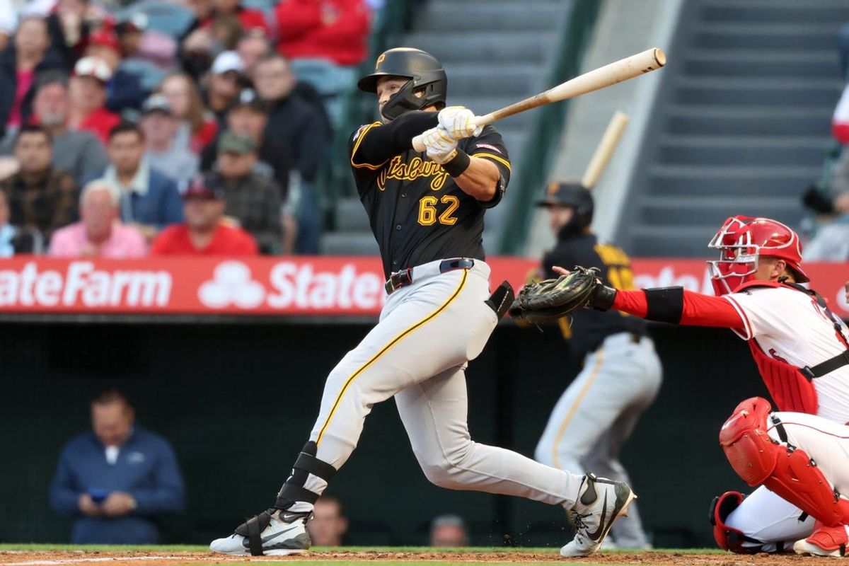Apr 24, 2025; Anaheim, California, USA;  Pittsburgh Pirates first baseman Matt Gorski (62) hits a home run during the first inning against the Los Angeles Angels at Angel Stadium. Gorski hits his first MLB home run in the first MLB at bat. Mandatory Credit: Kiyoshi Mio-Imagn Images