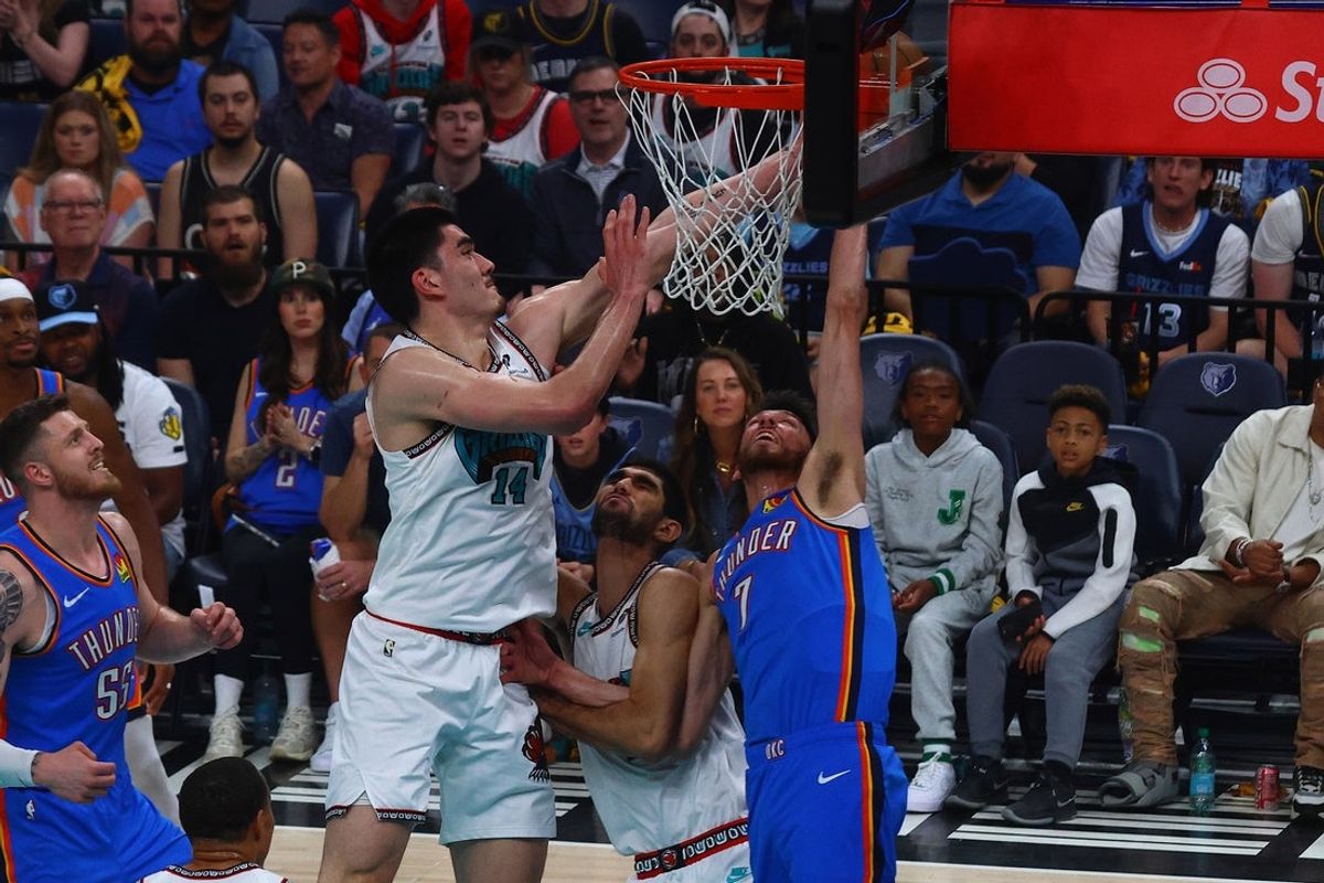 Apr 24, 2025; Memphis, Tennessee, USA; Memphis Grizzlies center Zach Edey (14) blocks the shot attempt by Oklahoma City Thunder forward Chet Holmgren (7) during the first quarter during game three for the first round of the 2024 NBA Playoffs at FedExForum. Mandatory Credit: Petre Thomas-Imagn Images