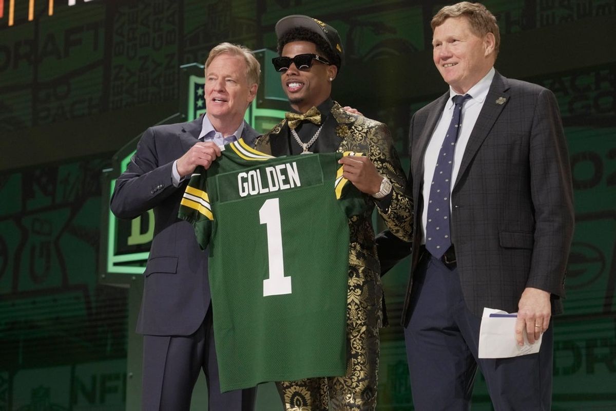 Wide Receiver Matthew Golden of Texas poses with NFL Commissioner Roger Goodell and President and CEO of the Green Bay Packers Mark Murphy after being selected twenty-third overall pick by the Green Bay Packers during the first round of the 2025 NFL Draft at Lambeau Field on April 24, 2025 in Green Bay.