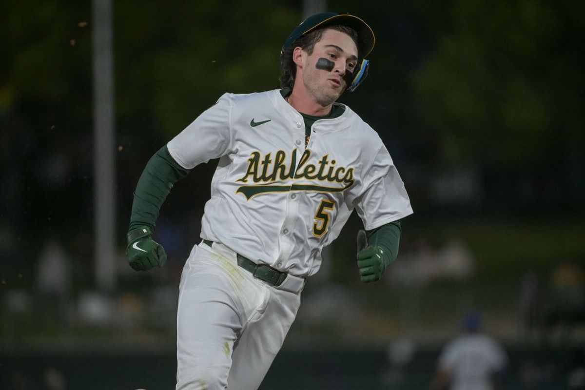 Apr 24, 2025; West Sacramento, California, USA; Athletics shortstop Jacob Wilson (5) rounds third base on his way to score against the Texas Rangers during the third inning at Sutter Health Park. Mandatory Credit: Ed Szczepanski-Imagn Images