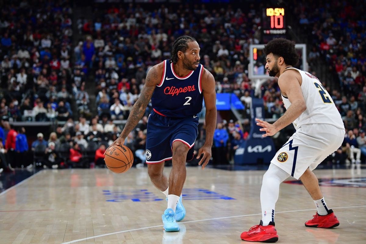 Apr 24, 2025; Inglewood, California, USA; Los Angeles Clippers forward Kawhi Leonard (2) moves the ball against Denver Nuggets guard Jamal Murray (27) during the second half of game three in the first round for the 2024 NBA Playoffs at Intuit Dome. Mandatory Credit: Gary A. Vasquez-Imagn Images