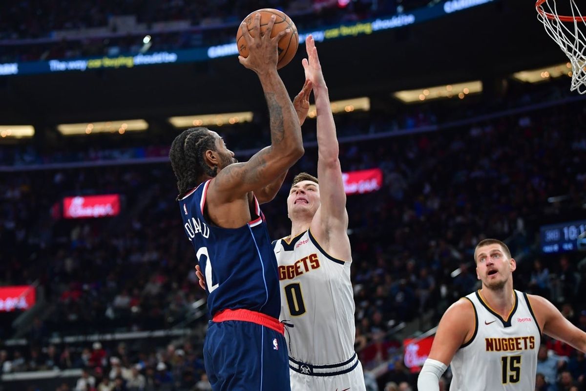 Apr 24, 2025; Inglewood, California, USA; Los Angeles Clippers forward Kawhi Leonard (2) shoots against Denver Nuggets guard Christian Braun (0) during the second half of game three in the first round for the 2024 NBA Playoffs at Intuit Dome. Mandatory Credit: Gary A. Vasquez-Imagn Images