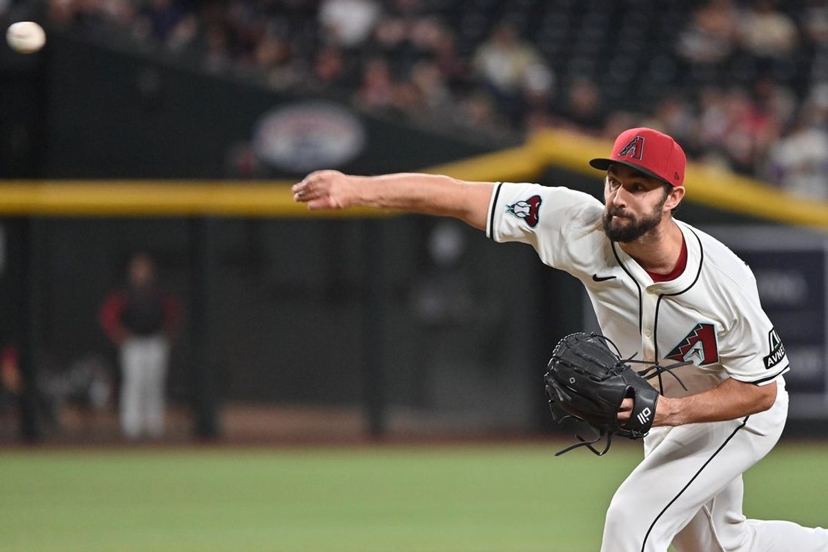 Apr 24, 2025; Phoenix, Arizona, USA;  Arizona Diamondbacks pitcher J.P. Feyereisen (61) throws in the tenth inning against the Tampa Bay Rays at Chase Field. Mandatory Credit: Matt Kartozian-Imagn Images
