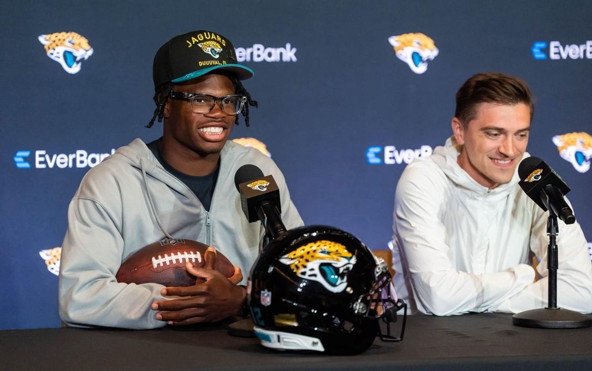 The Jacksonville Jaguars’ first-round pick, Colorado Buffaloes wide receiver and defensive back Travis Hunter, left, answers questions as General Manager James Gladstone, right, sits next to him during a press conference Friday, March 25, 2025 at Miller Electric Center in Jacksonville, Fla. [Doug Engle/Florida Times-Union]