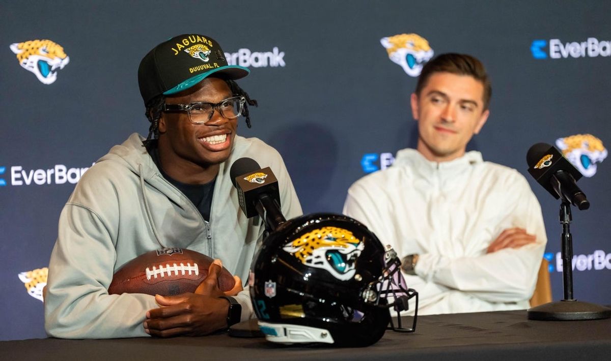 The Jacksonville Jaguars’ first-round pick, Colorado Buffaloes wide receiver and defensive back Travis Hunter, left, answers questions as General Manager James Gladstone, right, sits next to him during a press conference Friday, March 25, 2025 at Miller Electric Center in Jacksonville, Fla. [Doug Engle/Florida Times-Union]