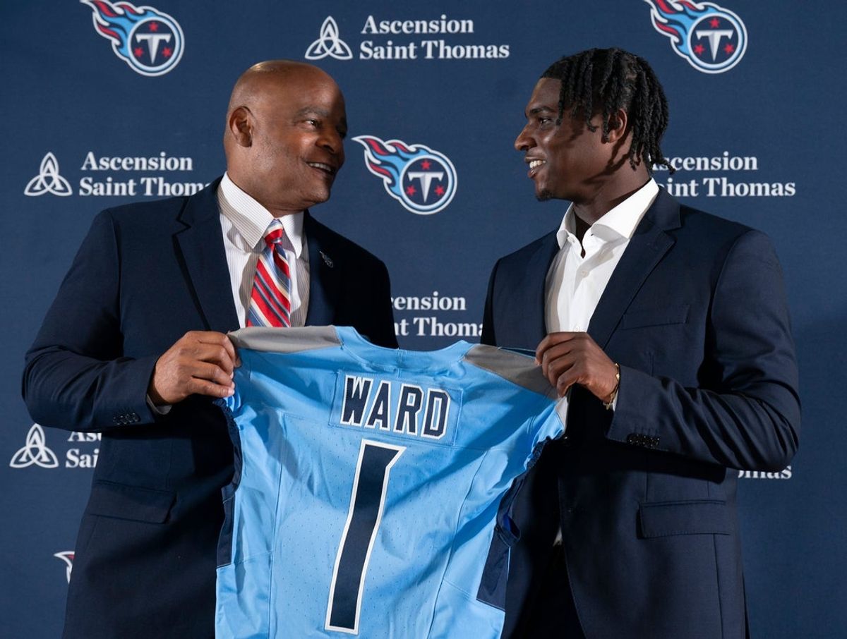 NFL Hall of Fame quarterback Warren Moon, left, poses for pictures with Cam Ward who earlier had been introduced as the Tennessee Titans first-round pick – and overall number one pick – in the NFL Draft at Ascension Saint Thomas Sports Park in Nashville, Tenn., Friday, April 25, 2025. Moon, whose No. 1 jersey is retired for the Tennessee Titans, allowed Ward to wear his number.