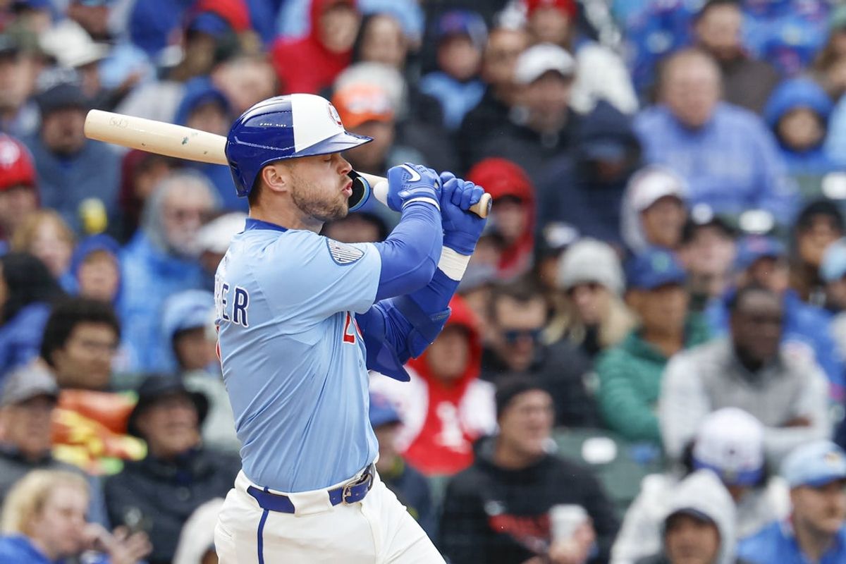 Apr 25, 2025; Chicago, Illinois, USA; Chicago Cubs second baseman Nico Hoerner (2) hits an RBI-single against the Philadelphia Phillies during the third inning at Wrigley Field. Mandatory Credit: Kamil Krzaczynski-Imagn Images