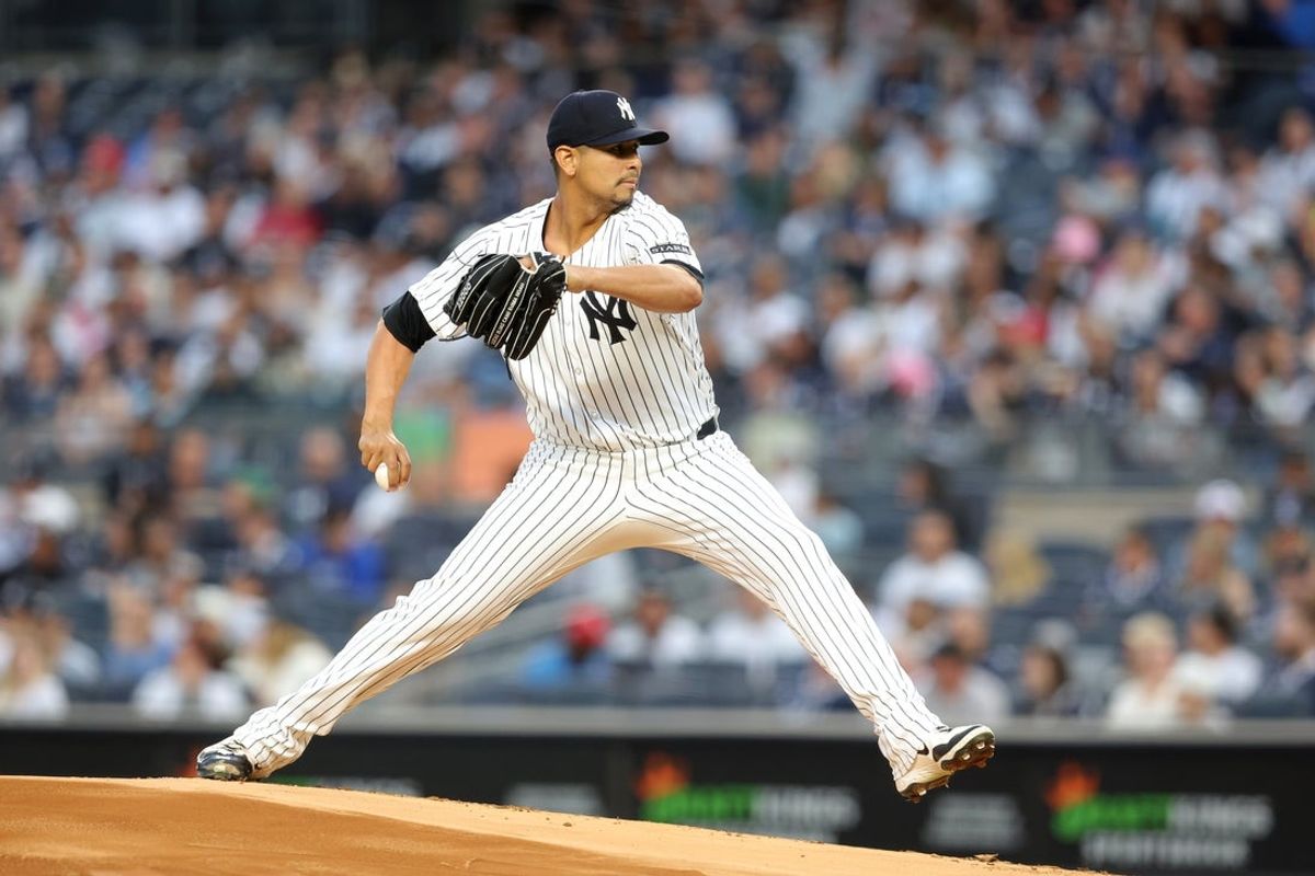 Apr 25, 2025; Bronx, New York, USA; New York Yankees starting pitcher Carlos Carrasco (59) pitches against the Toronto Blue Jays during the first inning at Yankee Stadium. Mandatory Credit: Brad Penner-Imagn Images