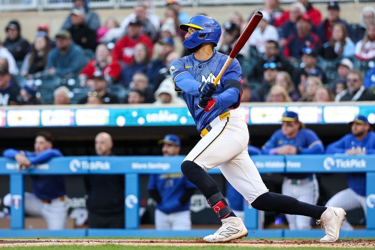 Apr 25, 2025; Minneapolis, Minnesota, USA; Minnesota Twins shortstop Carlos Correa (4) hits a sacrifice fly scoring a run against the Los Angeles Angels during the first inning at Target Field. Mandatory Credit: Matt Krohn-Imagn Images