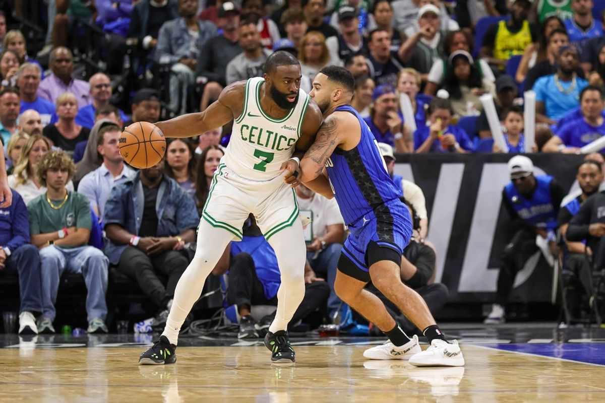 Apr 25, 2025; Orlando, Florida, USA; Boston Celtics guard Jaylen Brown (7) drives to the basket against Orlando Magic guard Cory Joseph (10) during the second quarter of game three of first round for the 2024 NBA Playoffs at Kia Center. Mandatory Credit: Mike Watters-Imagn Images