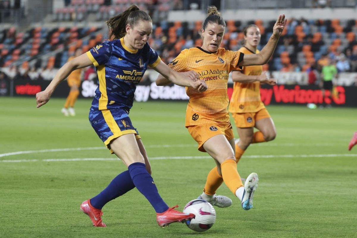Apr 25, 2025; Houston, Texas, USA; Utah Royals FC defender Janni Thomsen (7) controls the ball as Houston Dash defender Christen Westphal (20) defends during the first half at Shell Energy Stadium. Mandatory Credit: Troy Taormina-Imagn Images