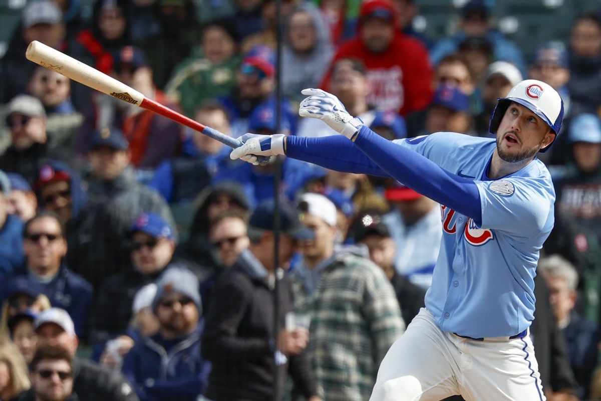 Apr 25, 2025; Chicago, Illinois, USA; Chicago Cubs right fielder Kyle Tucker (30) singles against the Philadelphia Phillies during the first inning at Wrigley Field. Mandatory Credit: Kamil Krzaczynski-Imagn Images