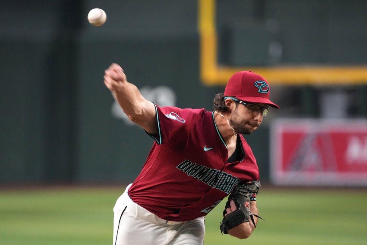 Apr 25, 2025; Phoenix, Arizona, USA; Arizona Diamondbacks pitcher Zac Gallen (23) throws against the Arizona Diamondbacks in the first inning at Chase Field. Mandatory Credit: Rick Scuteri-Imagn Images