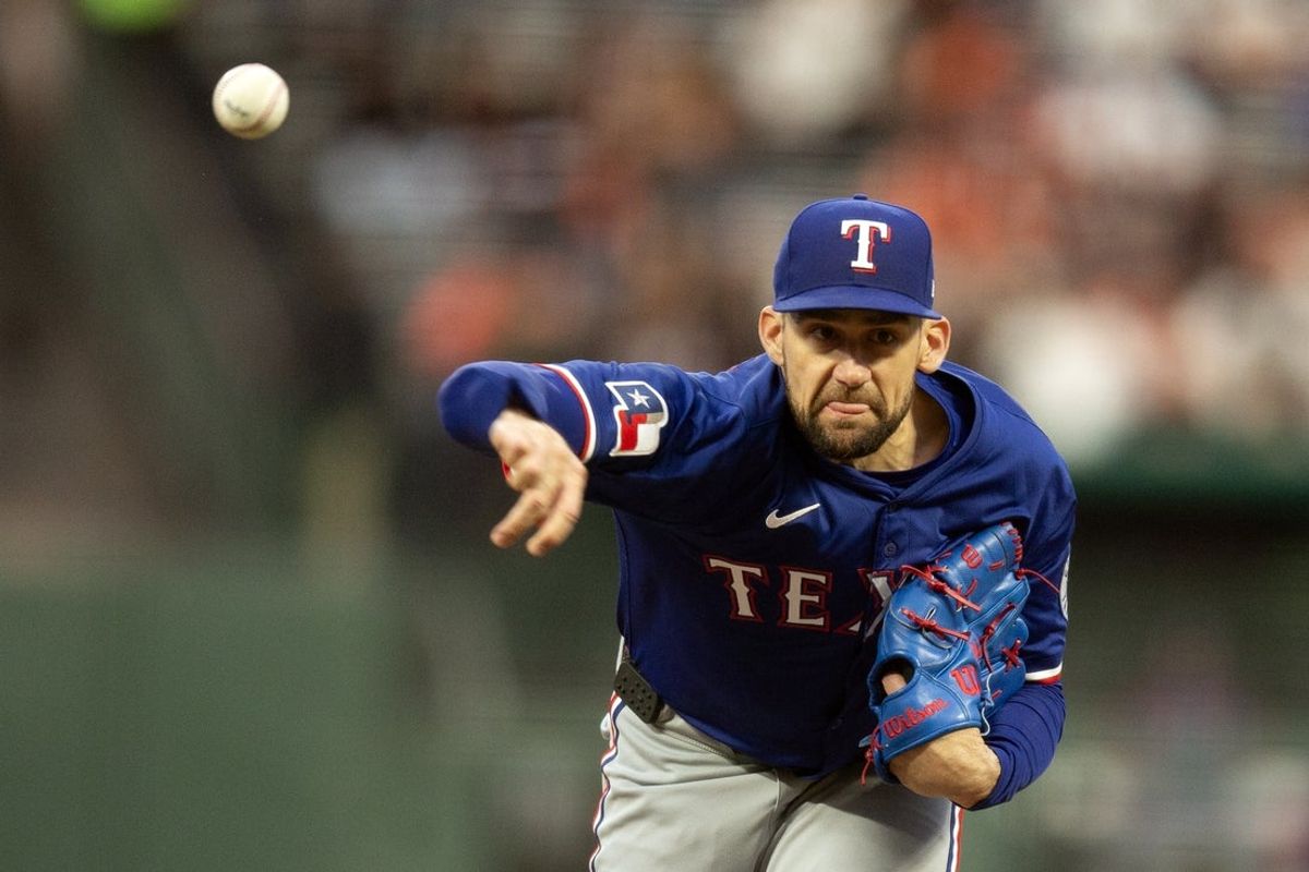 Apr 25, 2025; San Francisco, California, USA; Texas Rangers starting pitcher Nathan Eovaldi (17) delivers a pitch against the San Francisco Giants during the first inning at Oracle Park. Mandatory Credit: D. Ross Cameron-Imagn Images