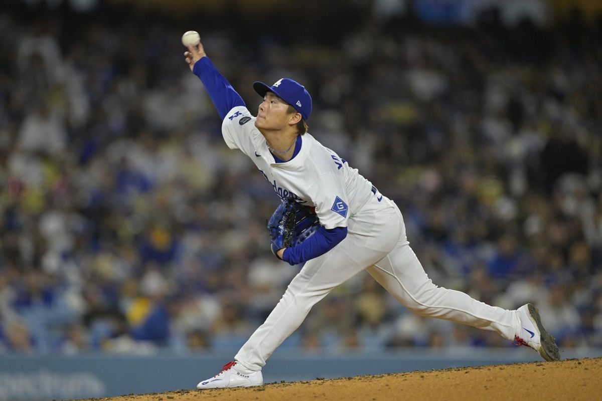 Apr 25, 2025; Los Angeles, California, USA;  Los Angeles Dodgers starting pitcher Yoshinobu Yamamoto (18) pitches during the third inning against the Pittsburgh Pirates at Dodger Stadium. Mandatory Credit: Jayne Kamin-Oncea-Imagn Images