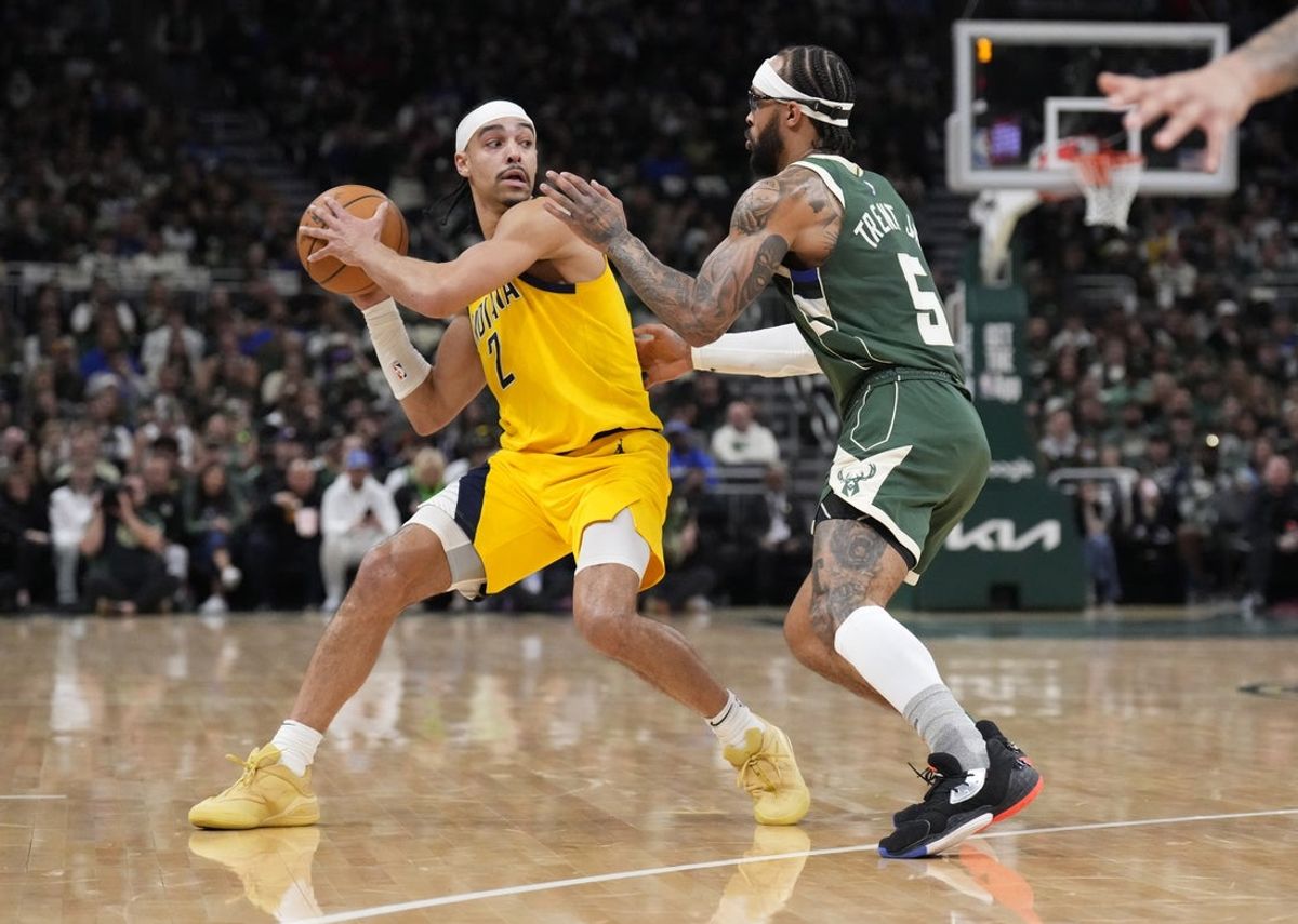 Apr 25, 2025; Milwaukee, Wisconsin, USA; Indiana Pacers guard Andrew Nembhard (2) looks for an outlet against Milwaukee Bucks guard Gary Trent Jr. (5) in the first half during game three of first round for the 2024 NBA Playoffs at Fiserv Forum. Mandatory Credit: Michael McLoone-Imagn Images