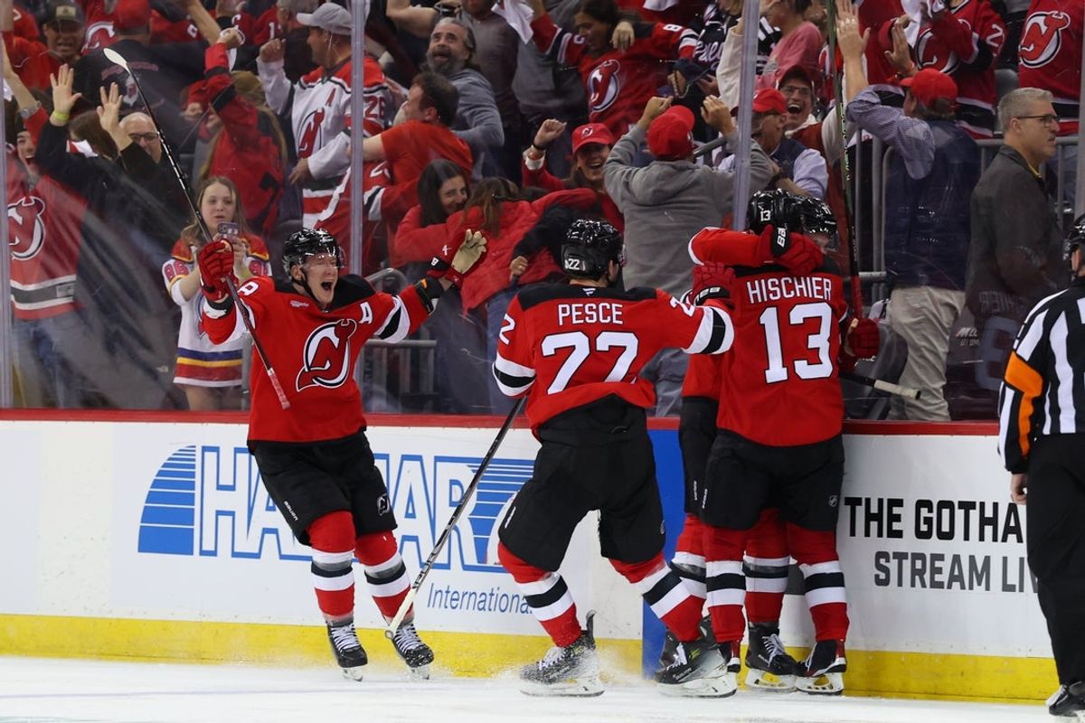 Apr 25, 2025; Newark, New Jersey, USA; New Jersey Devils defenseman Simon Nemec (17) celebrates his game winning goal against the Carolina Hurricanes during the second overtime in game three of the first round of the 2025 Stanley Cup Playoffs at Prudential Center. Mandatory Credit: Ed Mulholland-Imagn Images
