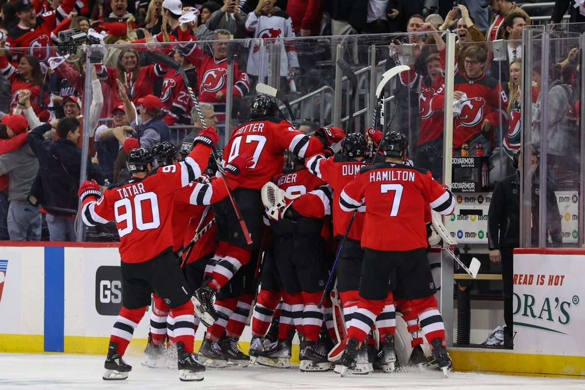 Apr 25, 2025; Newark, New Jersey, USA; New Jersey Devils defenseman Simon Nemec (17) celebrates his game winning goal against the Carolina Hurricanes during the second overtime in game three of the first round of the 2025 Stanley Cup Playoffs at Prudential Center. Mandatory Credit: Ed Mulholland-Imagn Images