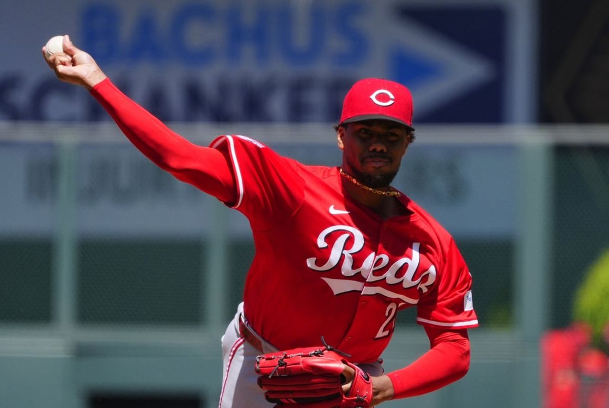 Apr 26, 2025; Denver, Colorado, USA; Cincinnati Reds starting pitcher Hunter Greene (21) delivers a pitch in the first inning against the Colorado Rockies at Coors Field. Mandatory Credit: Ron Chenoy-Imagn Images