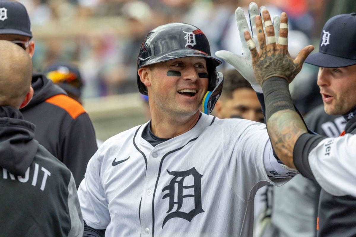 Apr 26, 2025; Detroit, Michigan, USA; Detroit Tigers first base Spencer Torkelson (20) celebrates with teammates in the dugout after hitting a solo home run against Baltimore Orioles pitcher Matt Bowman (51) in the seventh inning during game one of a double header at Comerica Park. Mandatory Credit: David Reginek-Imagn Images