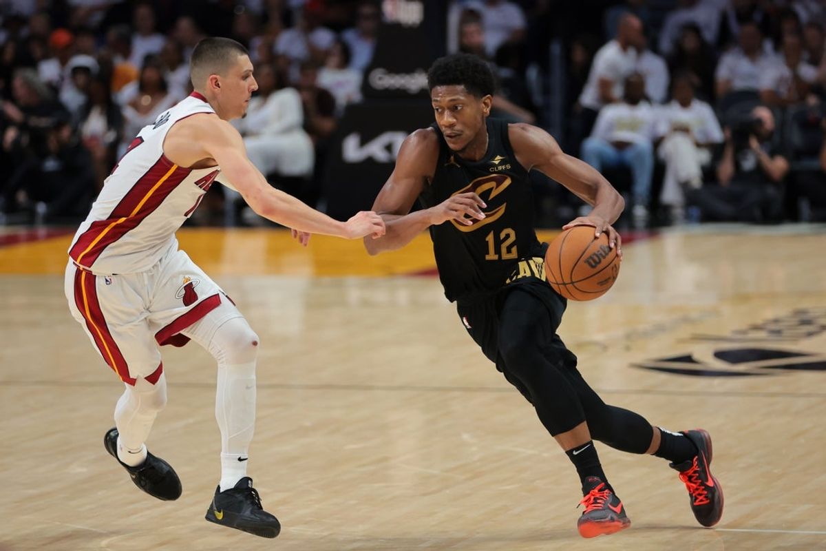 Apr 26, 2025; Miami, Florida, USA; Cleveland Cavaliers forward De'Andre Hunter (12) drives to the basket against Miami Heat guard Tyler Herro (14) in the fourth quarter during game three for the first round of the 2025 NBA Playoffs at Kaseya Center. Mandatory Credit: Sam Navarro-Imagn Images