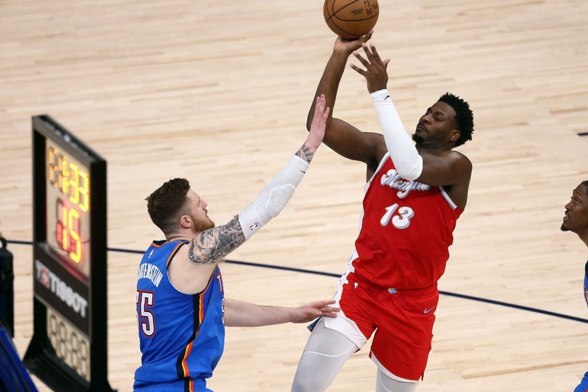 Apr 26, 2025; Memphis, Tennessee, USA; Memphis Grizzlies forward Jaren Jackson Jr. (13) shoots as Oklahoma City Thunder center Isaiah Hartenstein (55) defends during the second quarter during game four for the first round of the 2024 NBA Playoffs at FedExForum. Mandatory Credit: Petre Thomas-Imagn Images