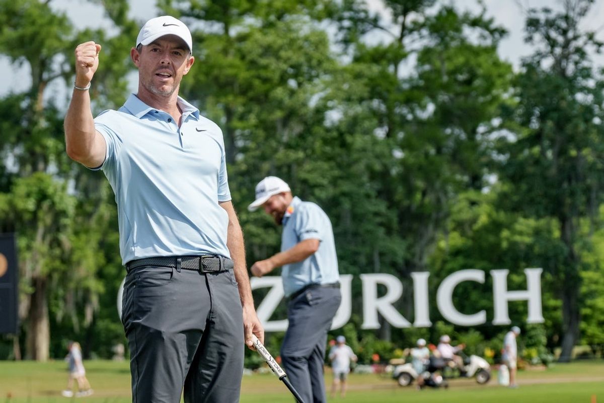 Apr 26, 2025; Avondale, Louisiana, USA;  Rory McIlroy reacts to an eagle putt on the 18th hole as his teammate Shane Lowry pumps his fist during the third round of the Zurich Classic of New Orleans golf tournament. Mandatory Credit: Matthew Hinton-Imagn Images