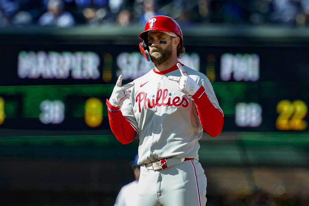 Apr 26, 2025; Chicago, Illinois, USA; Philadelphia Phillies first baseman Bryce Harper (3) celebrates after hitting a two-run double against the Chicago Cubs during the fourth inning at Wrigley Field. Mandatory Credit: Kamil Krzaczynski-Imagn Images