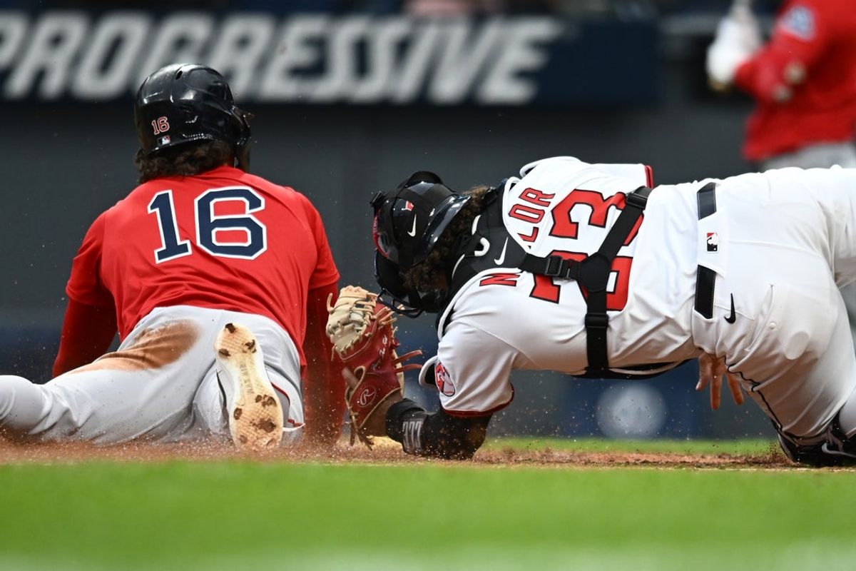 Apr 26, 2025; Cleveland, OH, USA; Boston Red Sox left fielder Jarren Duran (16) steals home under the tag of Cleveland Guardians catcher Bo Naylor (23) during the third inning at Progressive Field. Mandatory Credit: Ken Blaze-Imagn Images