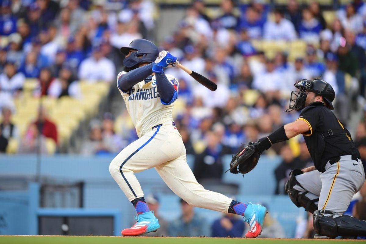 Apr 26, 2025; Los Angeles, California, USA; Los Angeles Dodgers outfielder Teoscar Hernandez (37) hits an RBI double in the first inning against the Pittsburgh Pirates at Dodger Stadium. Mandatory Credit: Gary A. Vasquez-Imagn Images