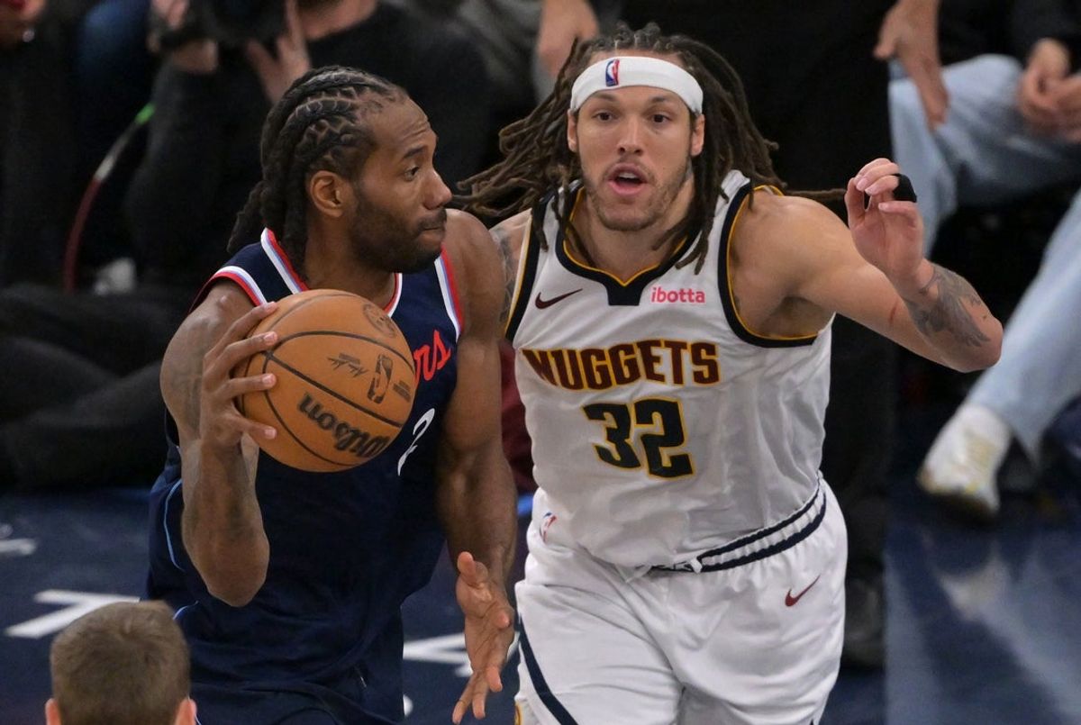 Apr 26, 2025; Inglewood, California, USA;  Los Angeles Clippers forward Kawhi Leonard (2) is defended by Denver Nuggets forward Aaron Gordon (32) in the second half of game four of round one of the 2024 NBA Playoffs at Intuit Dome. Mandatory Credit: Jayne Kamin-Oncea-Imagn Images