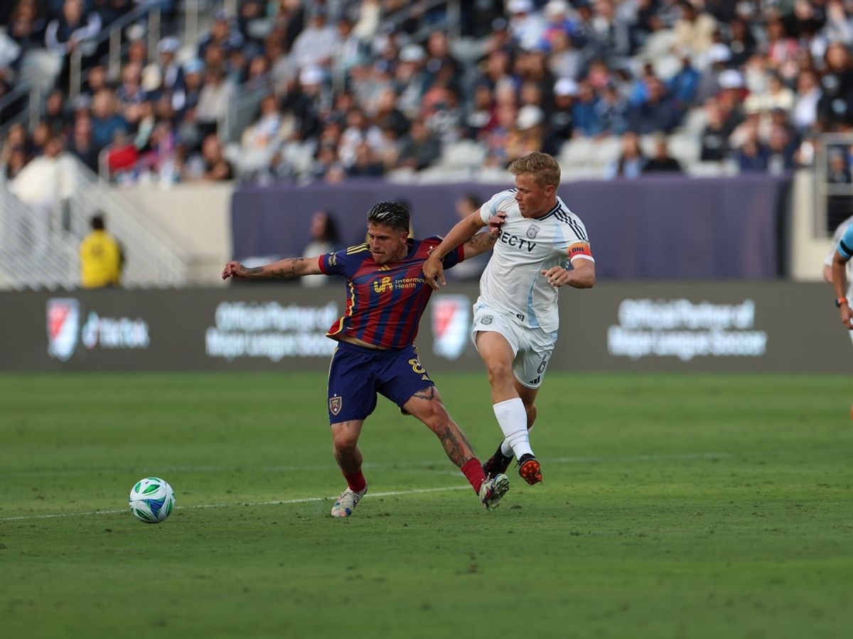 Apr 26, 2025; San Diego, California, USA; Real Salt Lake midfielder Diego Luna (8) and San Diego FC midfielder Jeppe Tverskov (6) battle for the ball during the second half  at Snapdragon Stadium. Mandatory Credit: Abe Arredondo-Imagn Images