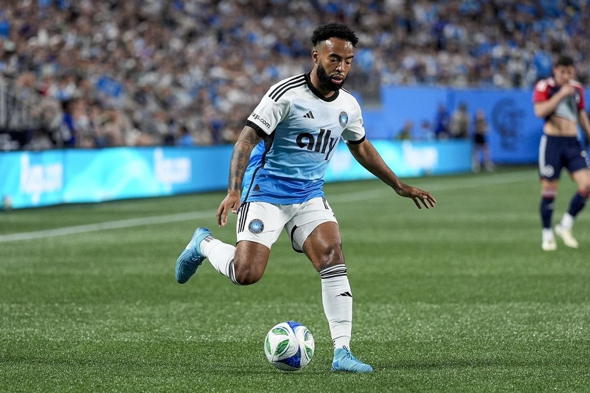 Apr 26, 2025; Charlotte, North Carolina, USA;  Charlotte FC midfielder Eryk Williamson (19) pushes the ball forward against the New England Revolution during the second half at Bank of America Stadium. Mandatory Credit: Jim Dedmon-Imagn Images